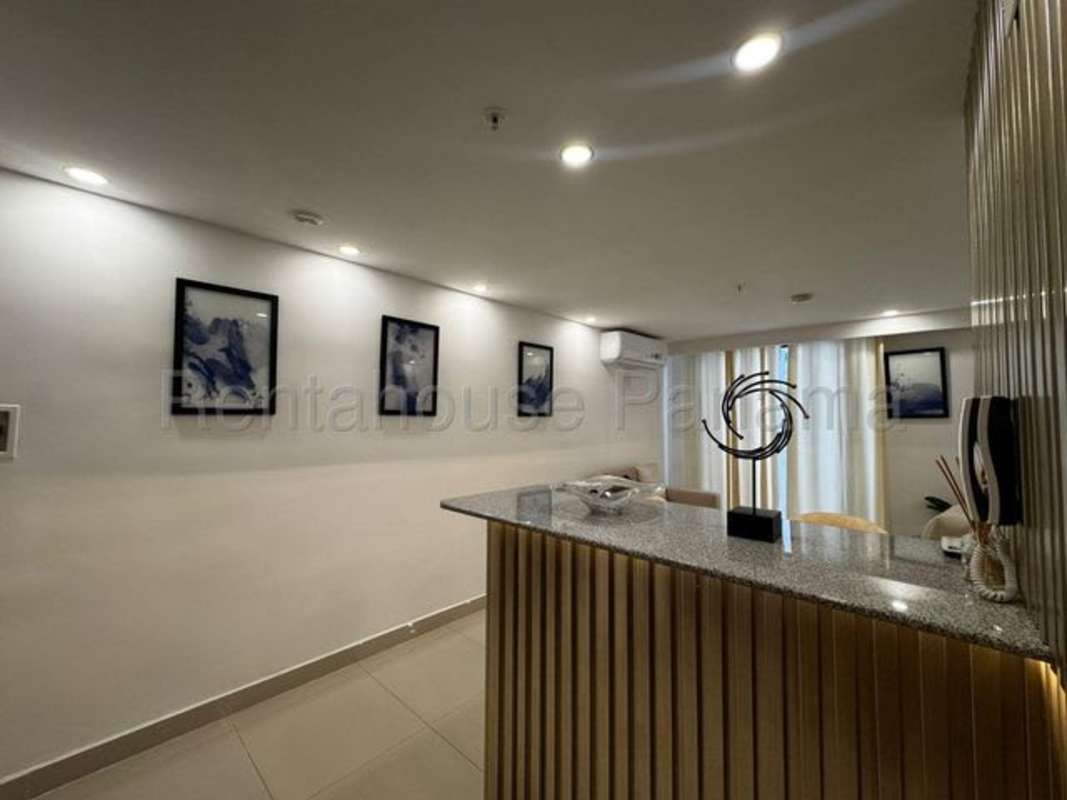 Modern bedroom with wall mirror and tiled floor in PH Torre Vista Panama City