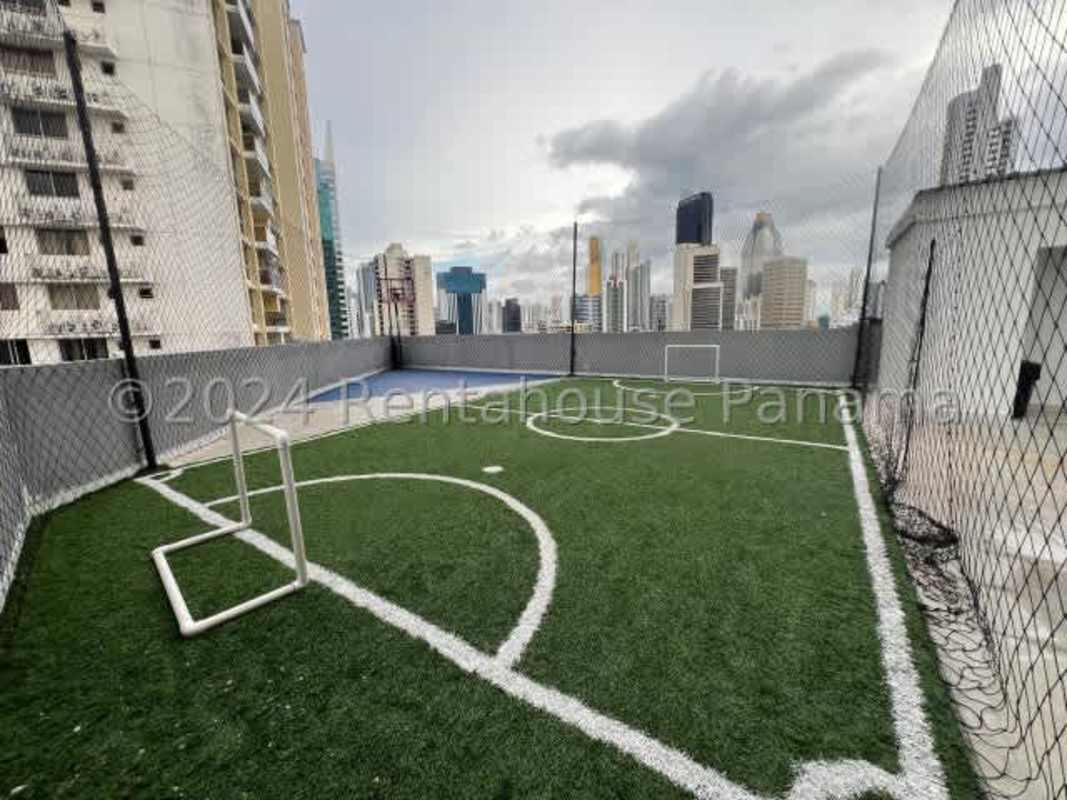 Rooftop mini soccer field with safety net and city view PH Torre Vista Panama