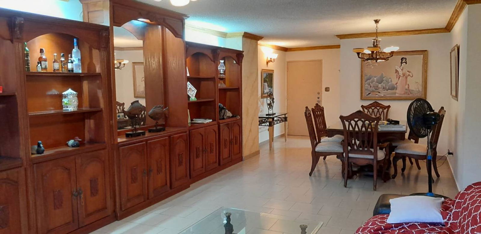 Traditional living dining area with wooden shelves tile floors PH Marina Plaza Marbella Panama