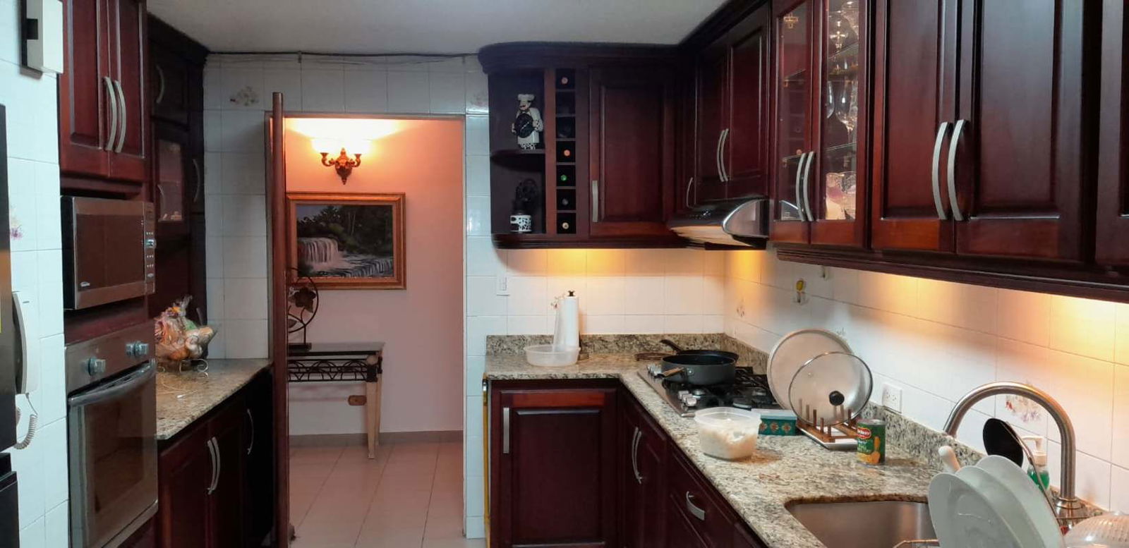 Traditional kitchen with granite countertops, wood cabinets PH Marina Plaza Marbella Panama City