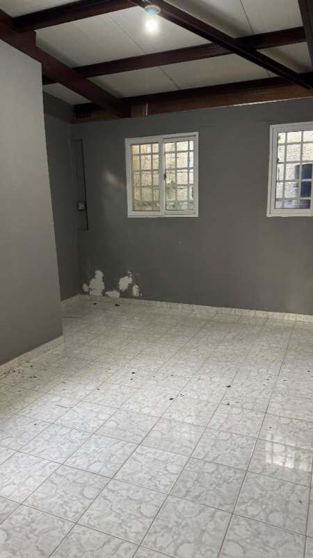 Unfinished room with tiled floor and window grilles in La Loceria commercial center Panama