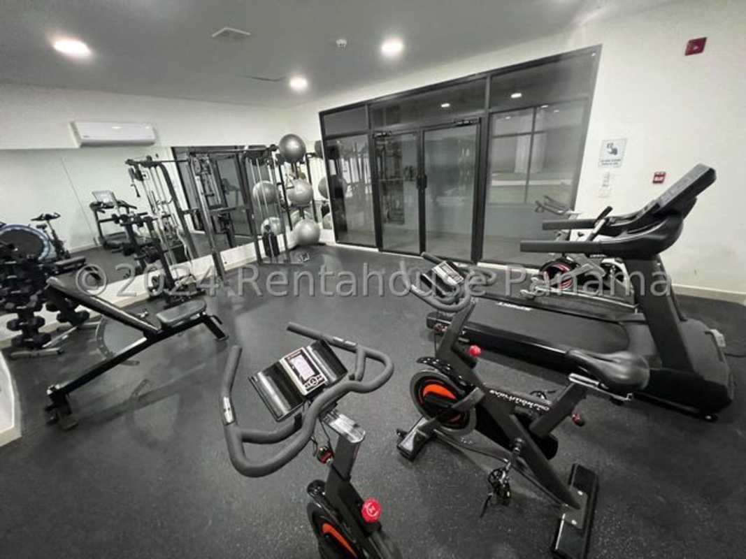 Contemporary bathroom with glass-enclosed shower, vanity and modern fixtures in Panama City apartment