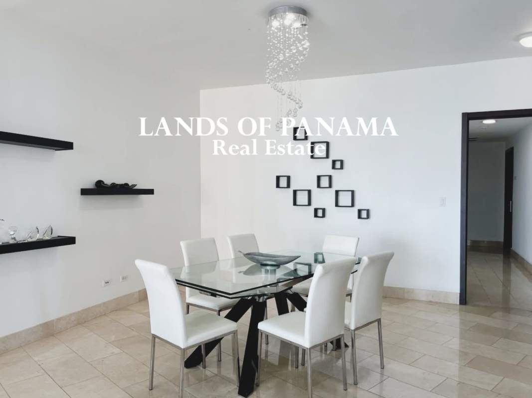 Modern living room with floor-to-ceiling glass, marble floors, ocean and skyline view in PH Grand Tower Punta Pacifica