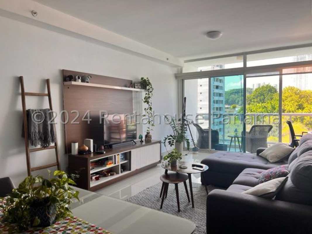 Kitchen with wooden cabinets, appliances, tile floors in El Cangrejo Panama apartment