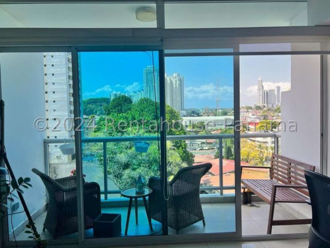 Bedroom with built-in closet, AC unit and tile floors in El Cangrejo apartment