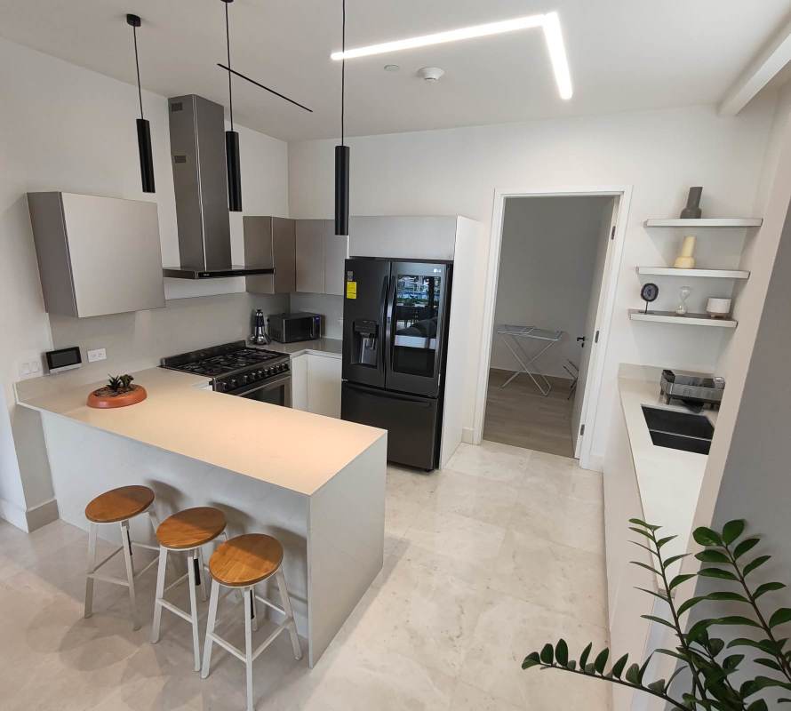 Gourmet kitchen with breakfast bar, stainless appliances in Trump Ocean Club apartment Punta Pacifica