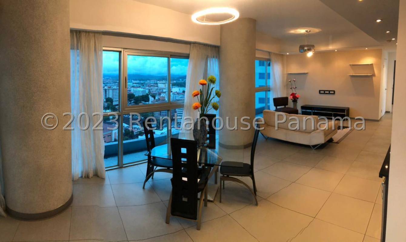 Living dining area with floor-to-ceiling windows city view in Yacht Club Tower Panama