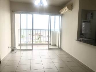 Light-filled living room with sliding doors to balcony ocean view Playa Dorada Panama