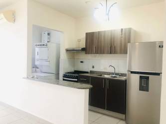 Open concept kitchen in apartment for sale Playa Dorada oceanfront Panama