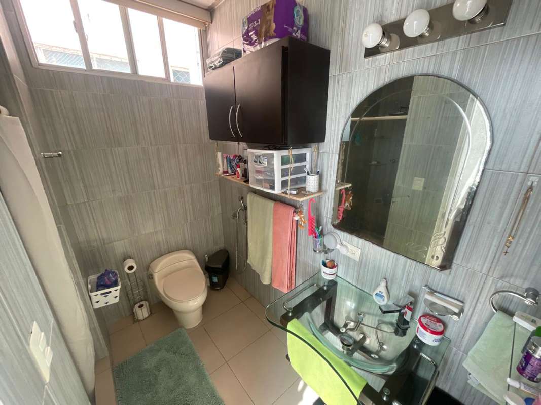 Modern bathroom with glass sink, tiled shower in PH Terramar San Francisco Panama