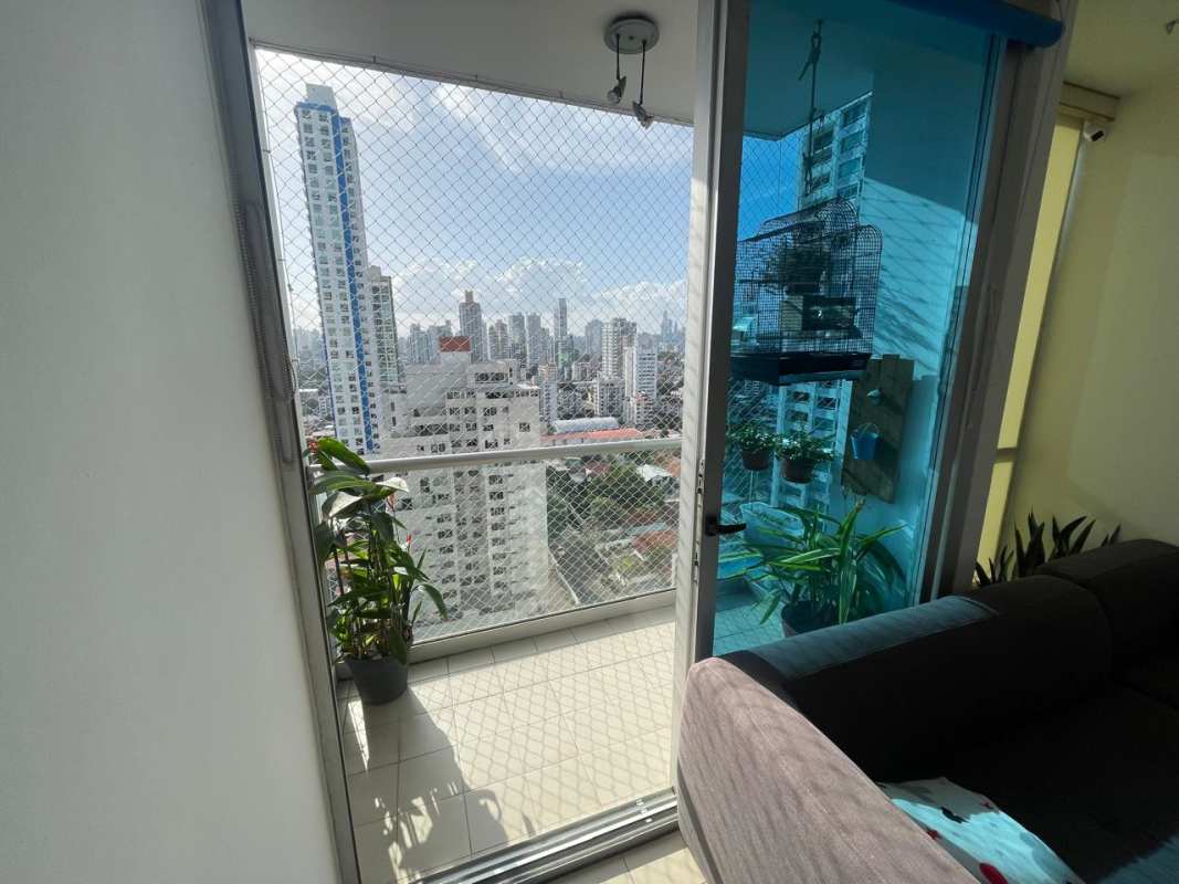 Bright secondary bedroom with AC unit, ceiling fan, closet and urban views in PH Terramar San Francisco