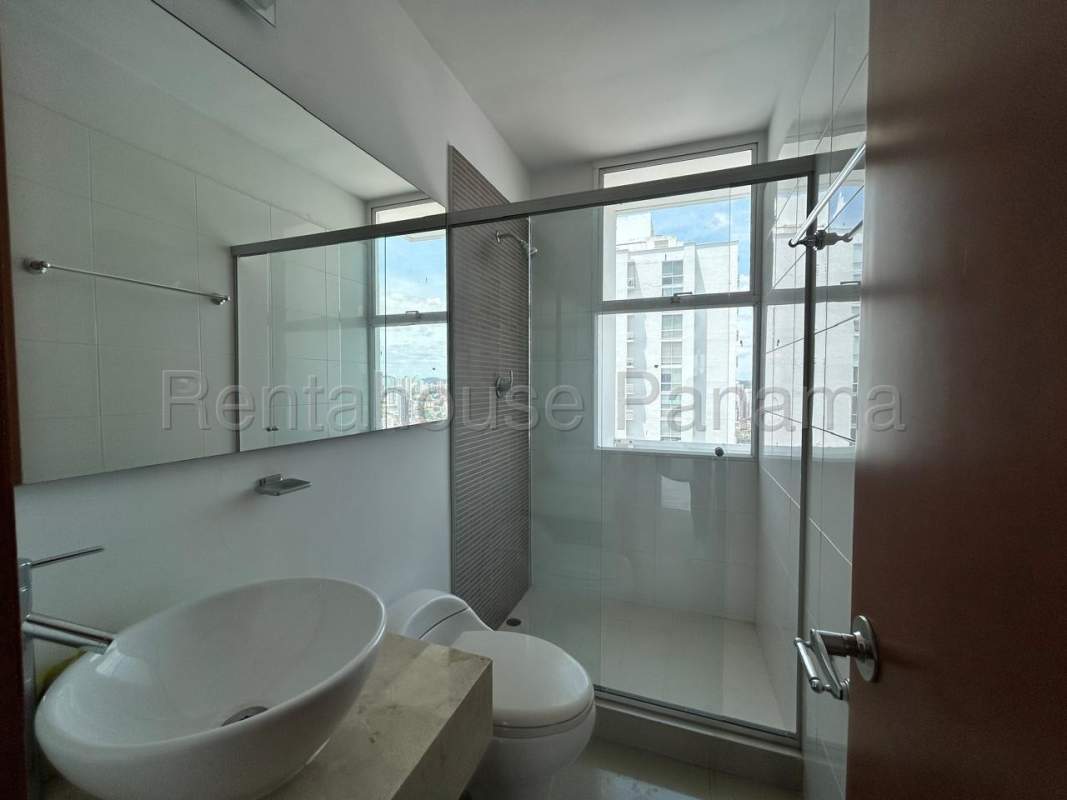Luxury bathroom with vessel sink, glass shower and city view at PH Bahia del Golf Coco del Mar