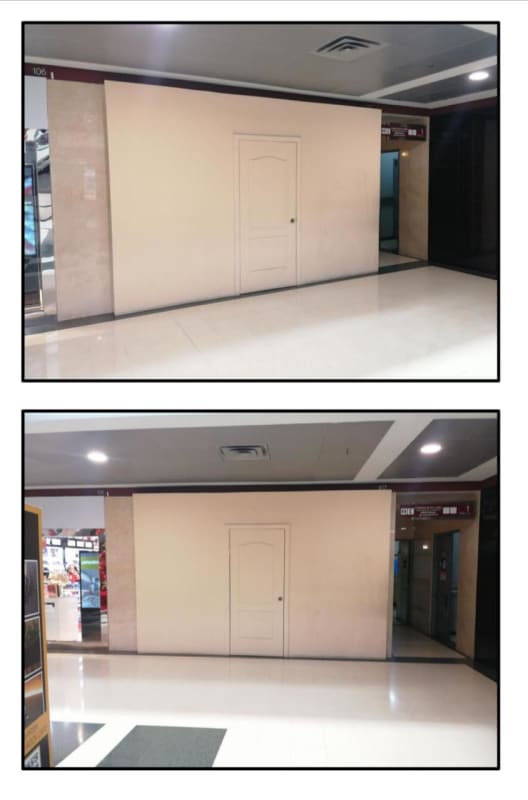 Interior shopping mall hallway with storefront partition temporary covering in PH Megapolis Outlets Panama