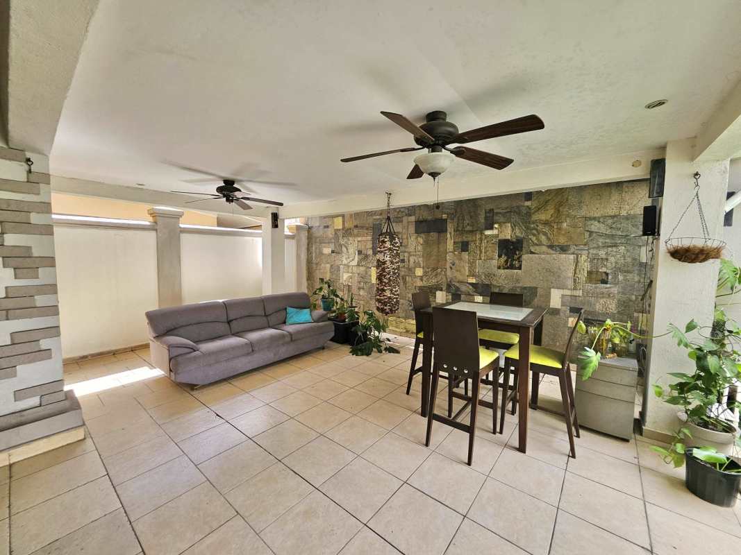Spacious patio terrace with BBQ grill and seating in rented house Paseo Dorado Condado del Rey Panama