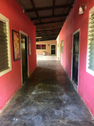Rustic corridor with doors in large house Montijo Veraguas Panama for sale