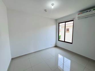 Contemporary bathroom with glass shower, granite countertop, bright and tiled