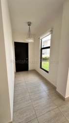 Bedroom with large windows, balcony access, built-in closet at Panama Pacifico home