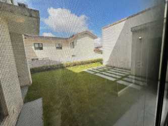 Full bathroom with modern vanity and glass enclosed shower inside Panama Pacifico home for sale