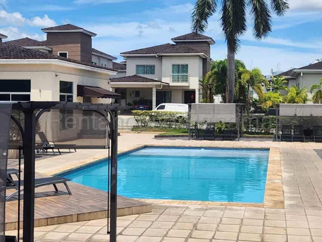 Large swimming pool and lounge area in gated Dorado Village Panama