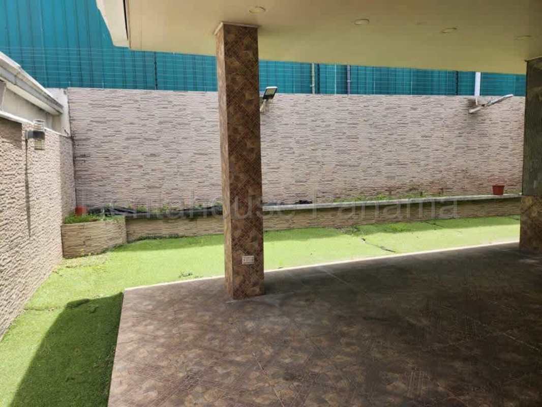 Backyard patio with artificial grass and covered seating Dorado Village Condado del Rey Panama City