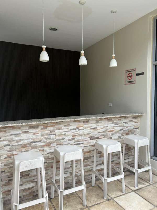 Bedroom featuring built-in wooden closet with shelves at PH Rokas Condado del Rey Panama