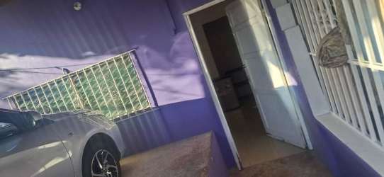 Basic kitchenette with sink and small table in budget studio room Burunga Panama