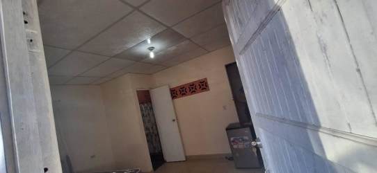 Simple entryway or hallway interior of budget studio room rental in Burunga Panama