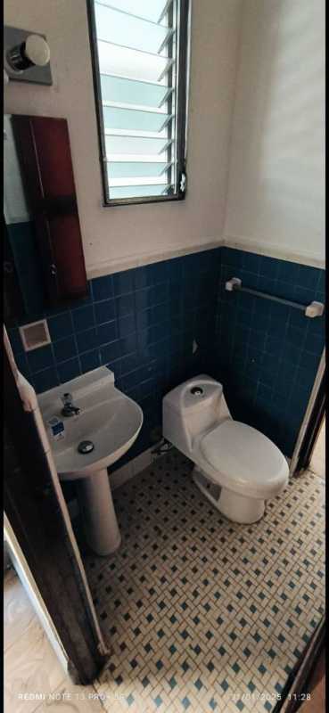 Simple laundry utility area with water heater and storage in PH Via Veneto Panama City