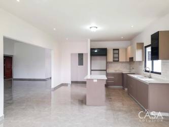 Bright modern kitchen with island, porcelain countertops, cabinetry Boquete Panama