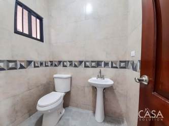 Open living room with kitchen island and large windows Boquete Panama