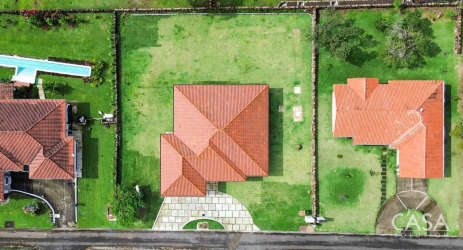 Drone image of mountain residential community with red tile roofs Boquete Panama