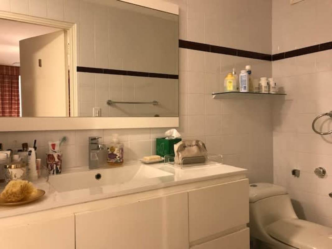 Contemporary bathroom with vanity, mirror and tile at PH El Cenit La Cresta Panama City