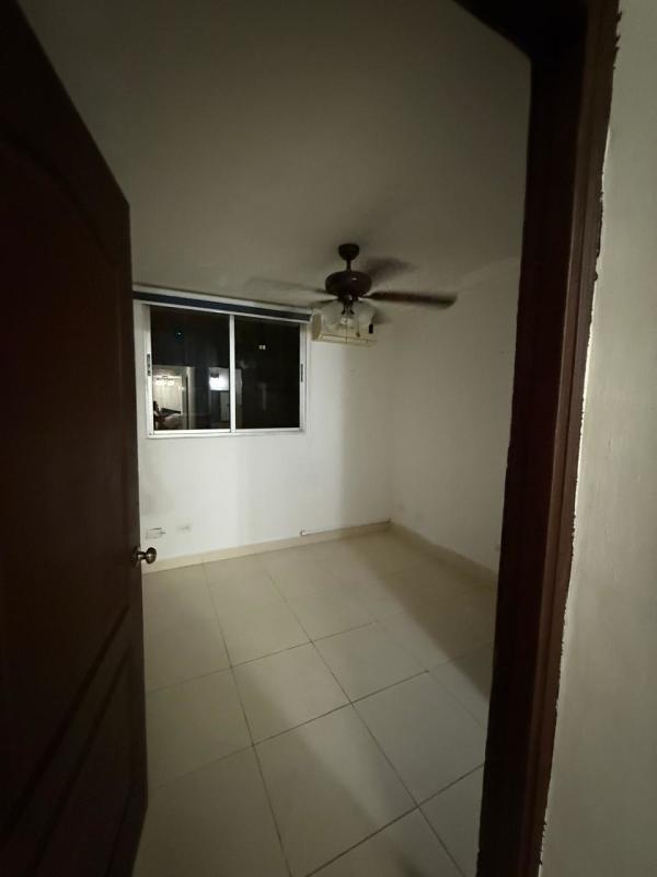 Bedroom with window to city, tile flooring, ceiling fan in PH Toscana Panama