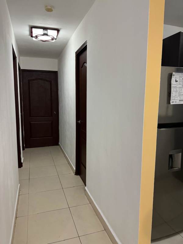 Hallway view connecting entry with kitchen in PH Toscana Condado del Rey Panama