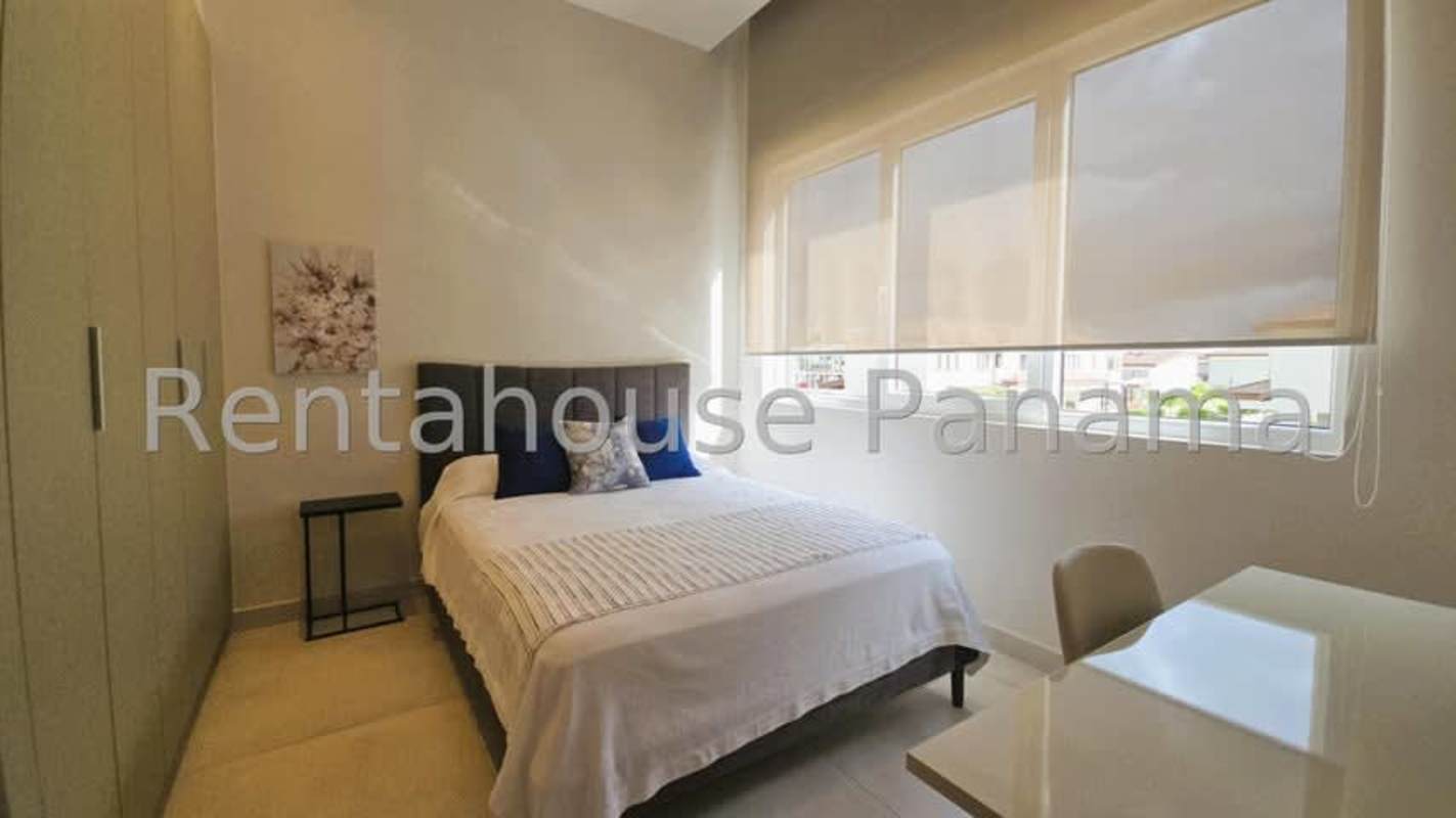 Bedroom with large windows and built-in closet in luxury duplex PH The Woods Santa Maria