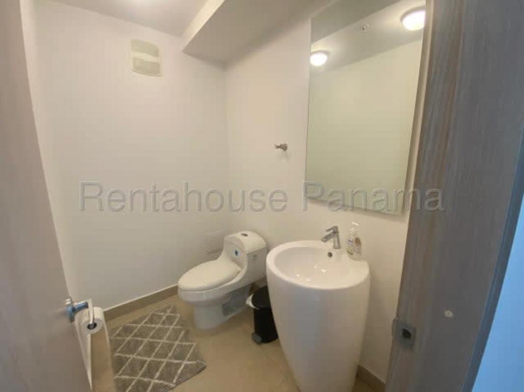 Spacious living room with large windows and access to balcony at PH Clayton Park in Clayton Panama