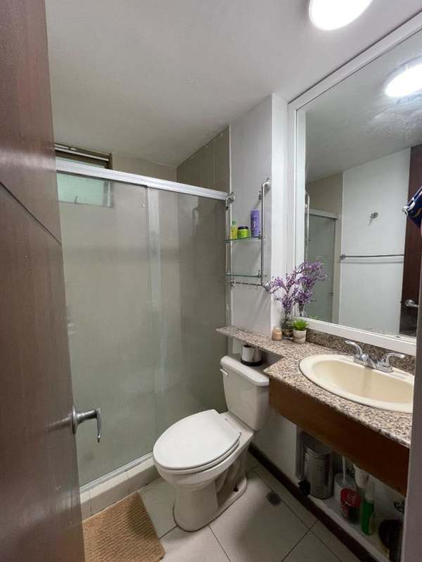 Modern bathroom glass enclosed shower granite countertop PH Pacific Wind Panama City