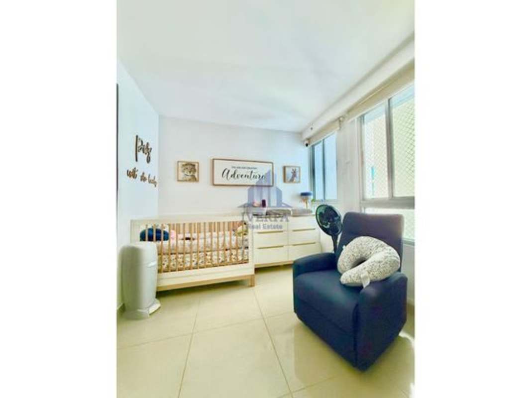 Nursery with crib, armchair, bright window PH Villa Vista Vía España Panama City
