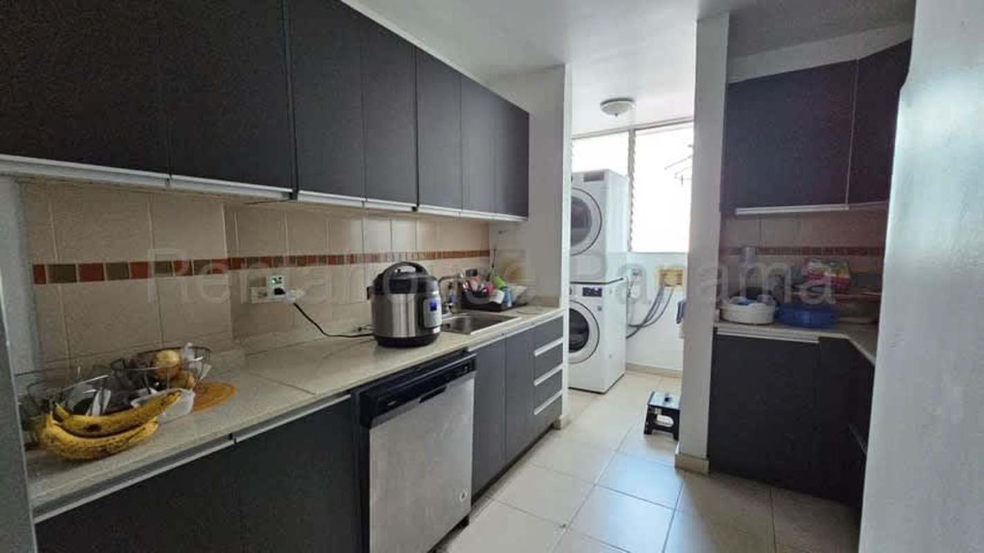 Modern kitchen with appliances and laundry Bella Vista Panama apartment for rent