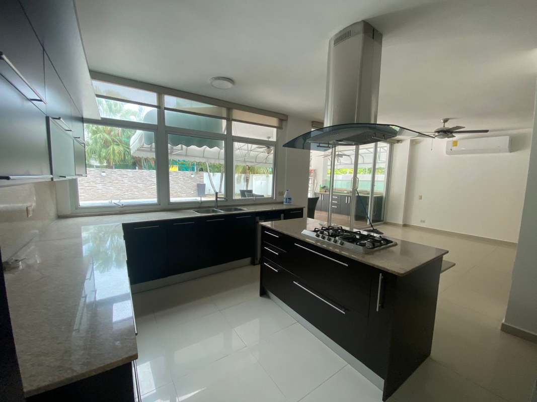Spacious kitchen with center island, stainless appliances and big windows Costa Sur