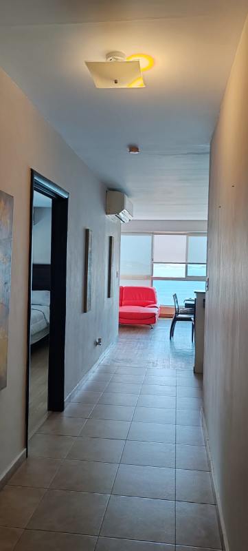 Kitchen with granite countertops, appliances, and breakfast bar in PH Bayfront Tower Panama City