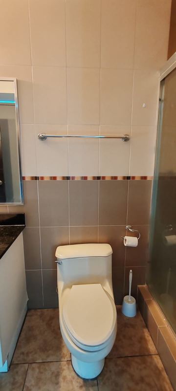 Master bedroom with large windows, walk-in closet, ensuite bathroom in PH Bayfront Tower Panama