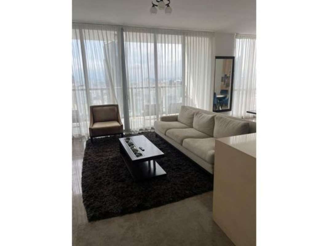 Modern living room with skyline view, floor-to-ceiling windows at PH Yoo Panama