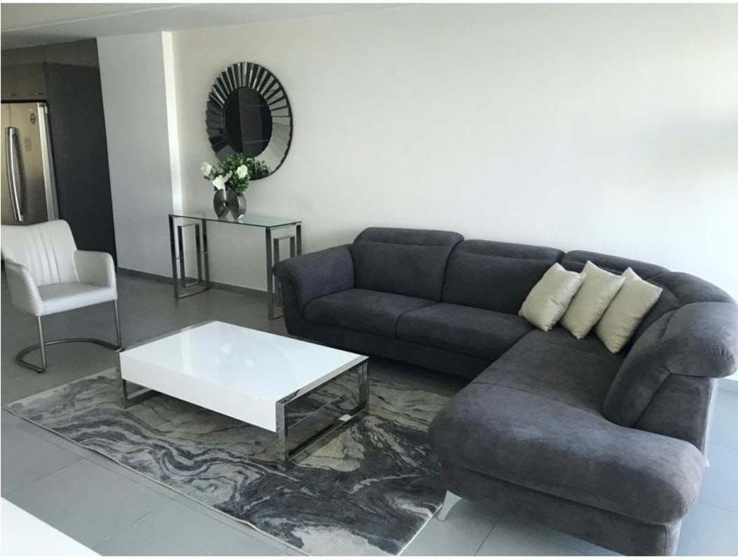 Spacious modern living area furnished with ocean and city skyline views in PH Yacht Club Panama