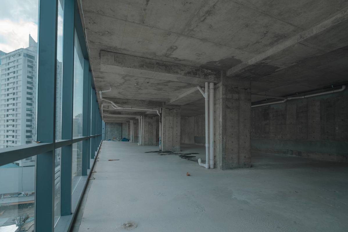 Raw shell office space with floor-to-ceiling windows and panoramic ocean views at Armani Tower The Ocean Club Panama City