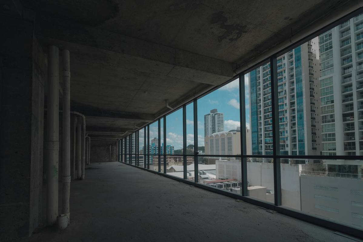 Open unfinished office with panoramic glass façade overlooking Pacific Ocean in Armani Tower at The Ocean Club Panama City