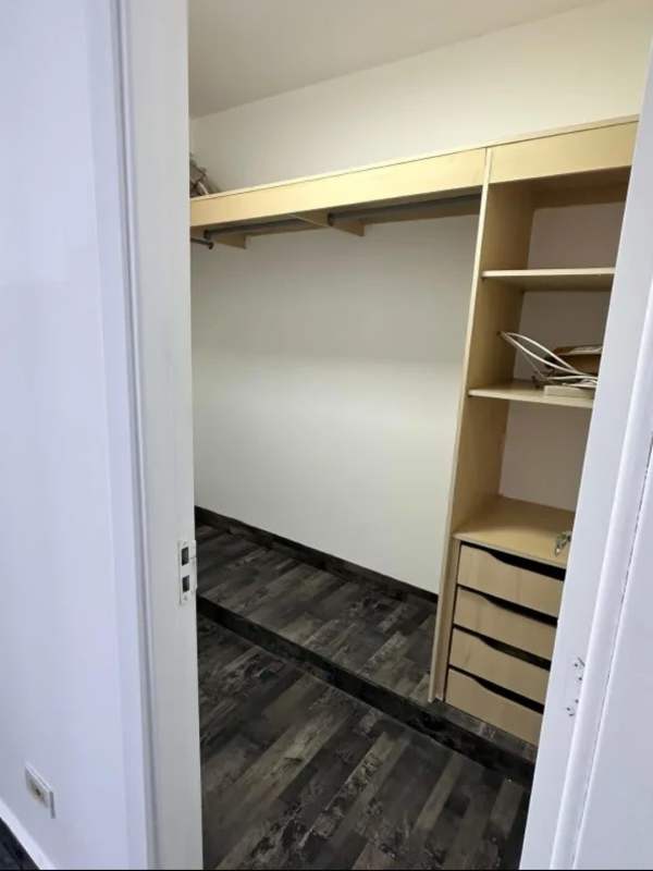 Large walk-in closet with custom built-ins in PH Coco Del Mar Panama City