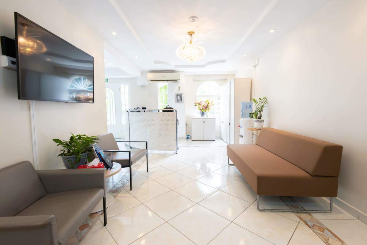 Waiting room with sofas, reception desk, plants at luxury house in Albrook, Panama City