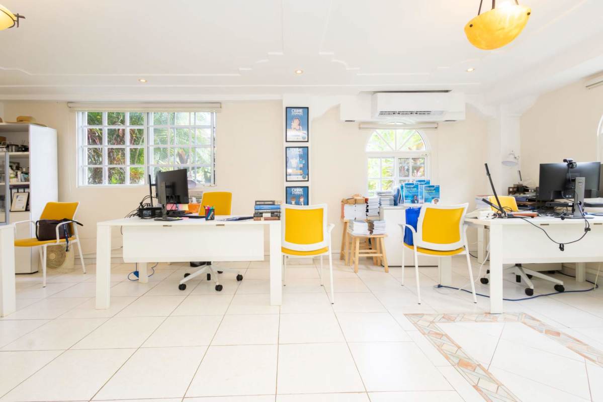 Home office room with large windows, tile floor, and bright workspace in Albrook residence