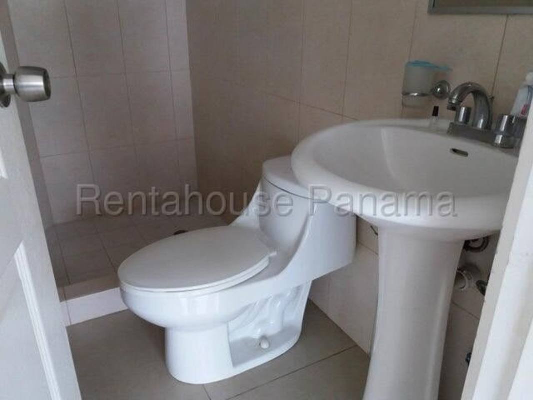 Contemporary bathroom with pedestal sink and tiled walls at PH Green Point Panama City